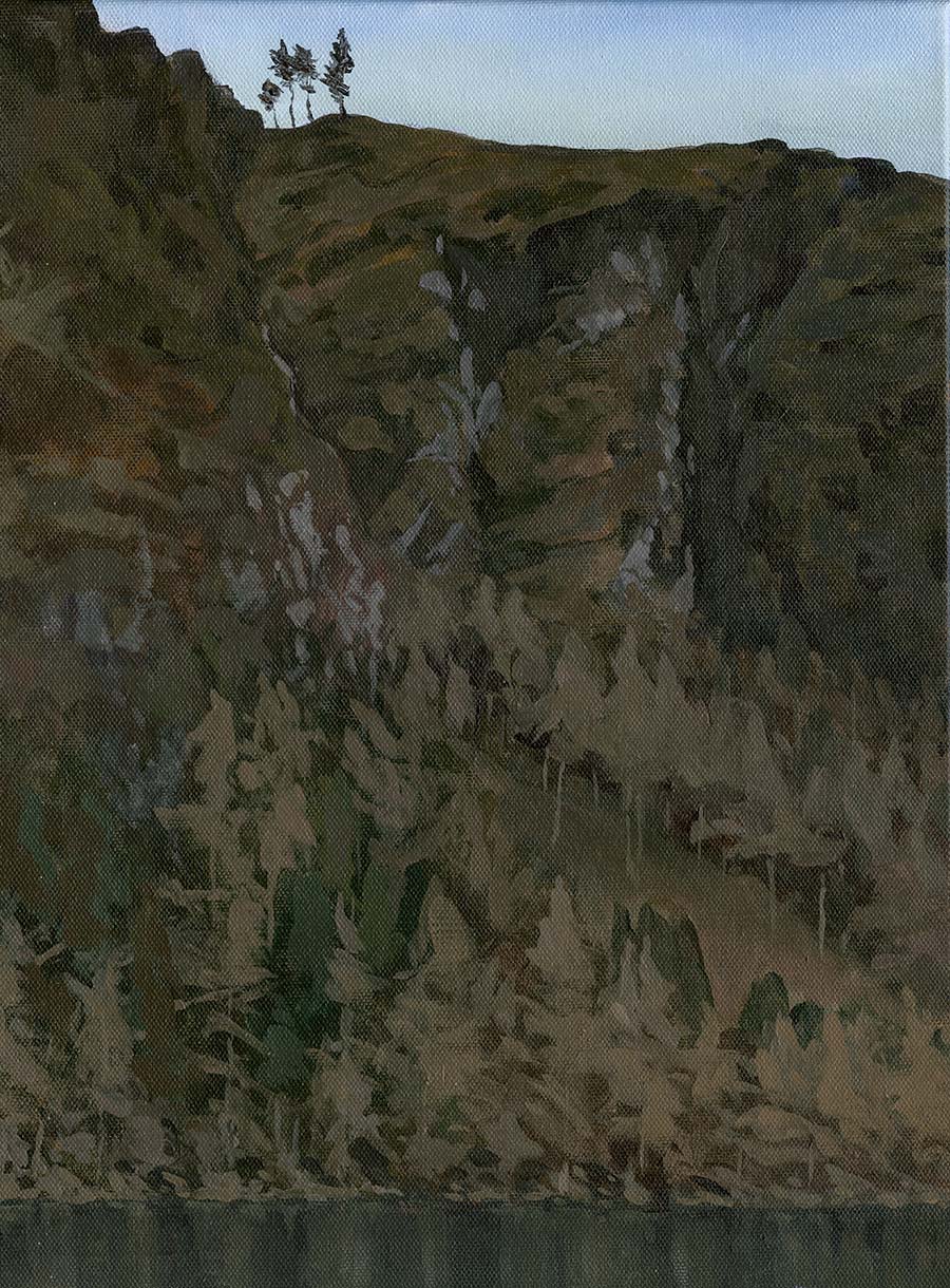 Painting of a view across the upper lake in Glendalough, with winter trees growing on the lower slopes of a cliff that gets steeper as it rises.